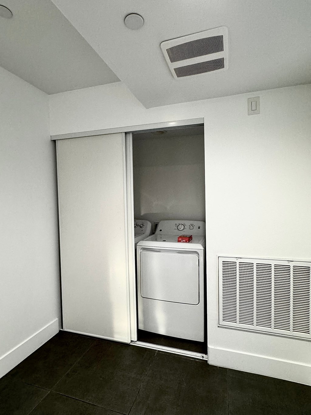 a white room with a washer and a dryer in it