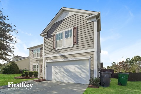 the exterior of a home with a white garage door