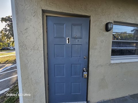 A blue door with a number 1 on it.