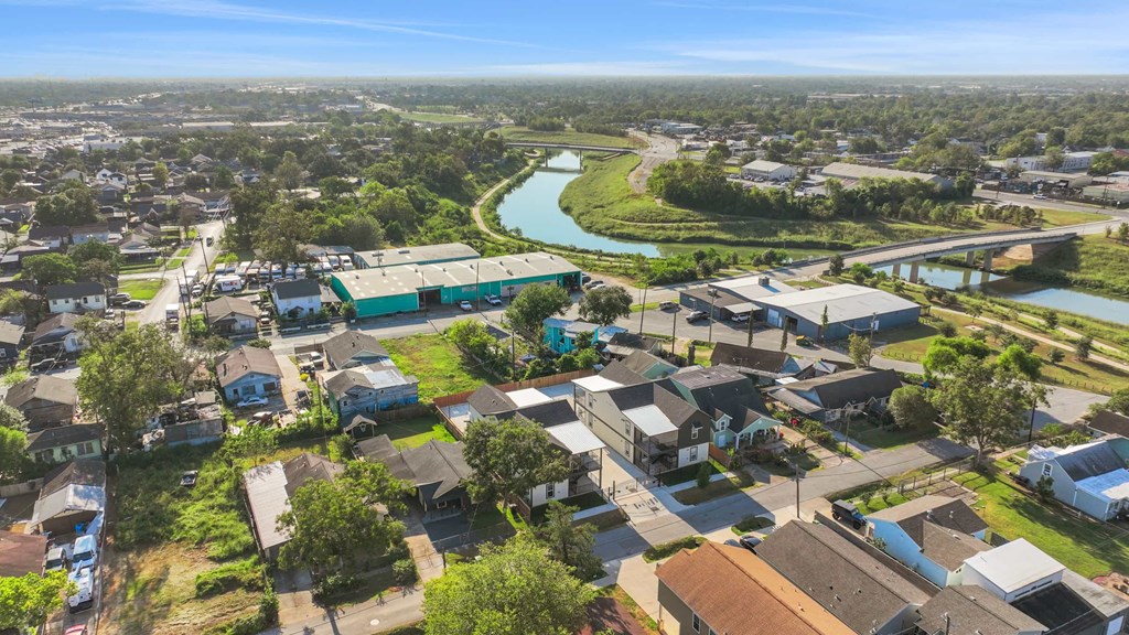an aerial view of a neighborhood with houses and a river