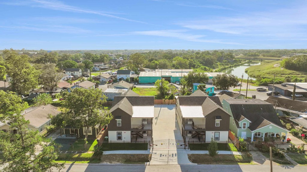 an aerial view of a neighborhood with houses and trees