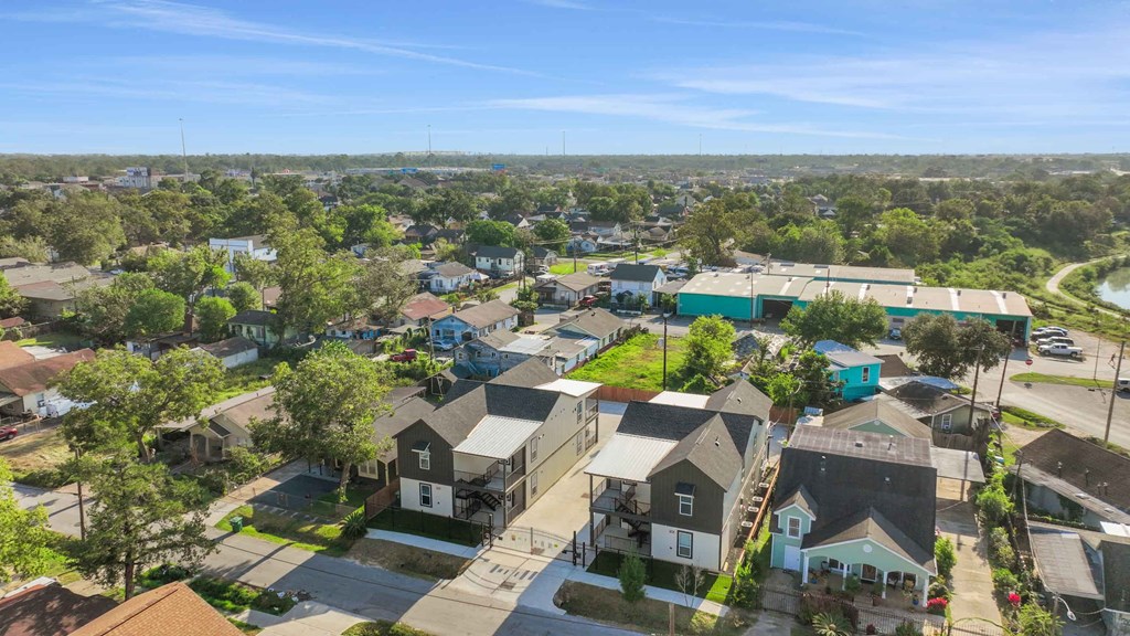 an aerial view of a neighborhood with houses and trees