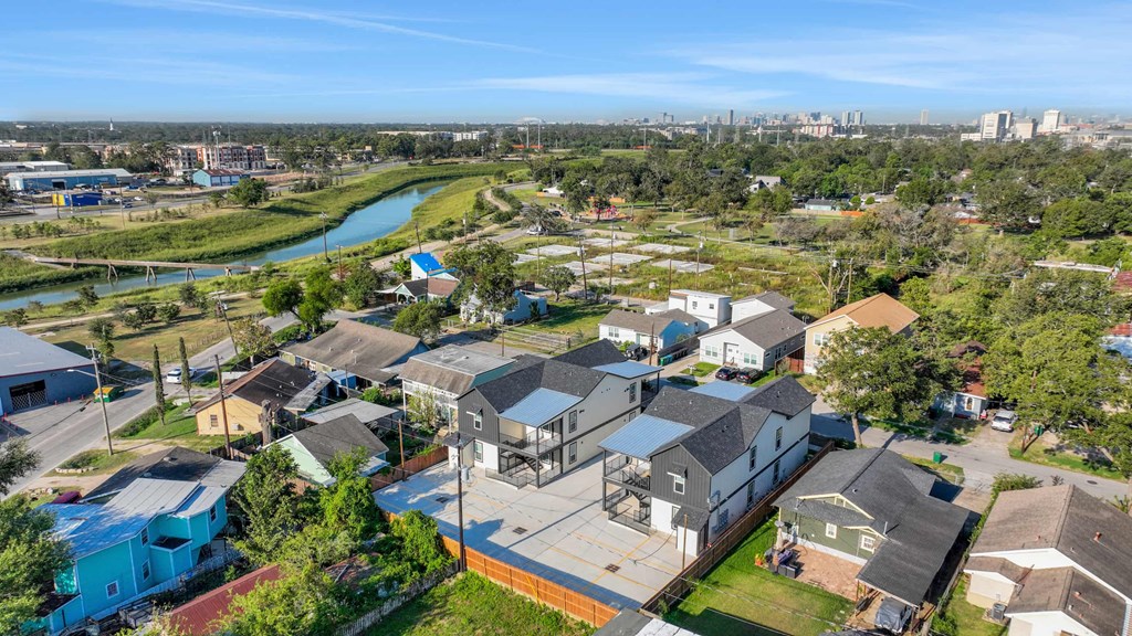 an aerial view of a neighborhood with houses and a river