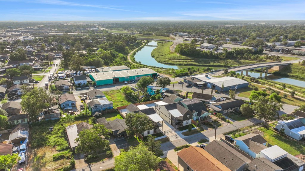 an aerial view of a neighborhood with houses and a river
