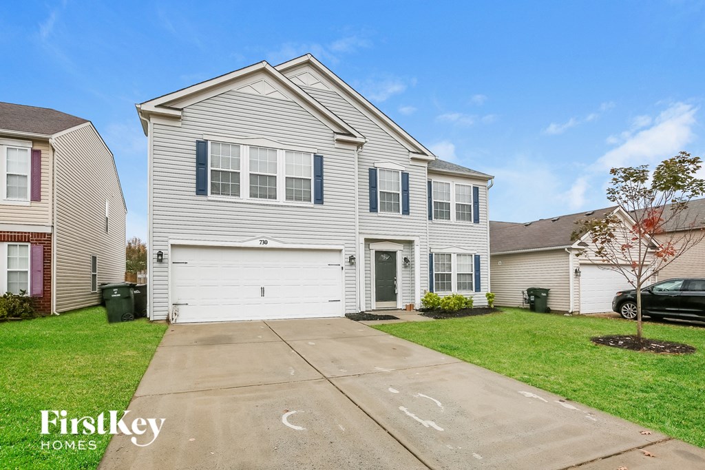 A house with a garage is for sale by FirstKey Homes.