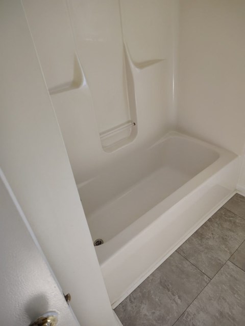 a bathroom with a shower and a toilet in it