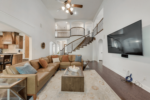 a living room with a couch and a tv