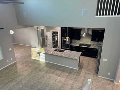 a large kitchen with a large island in the middle