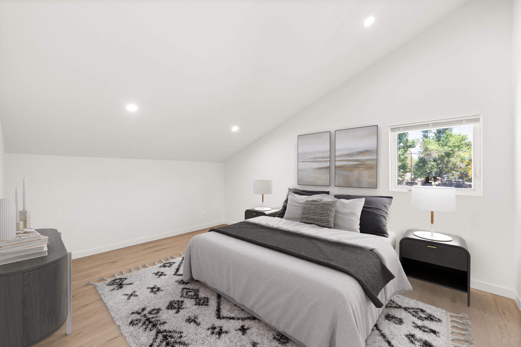 A bedroom with a large bed and a nightstand.