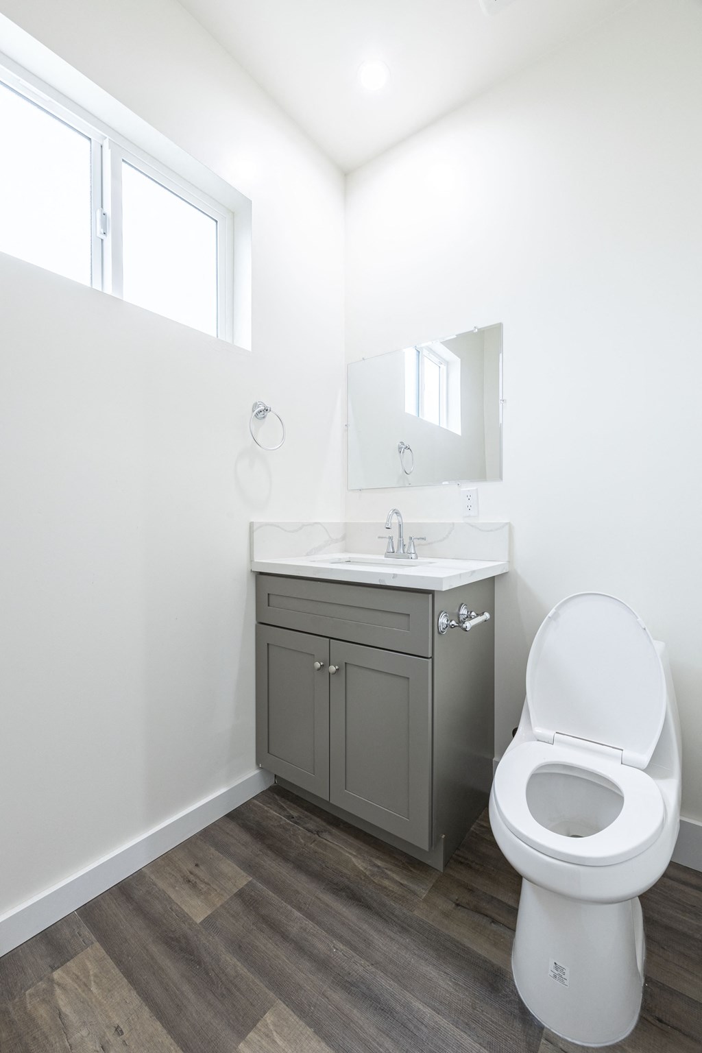 an empty bathroom with a toilet and a sink