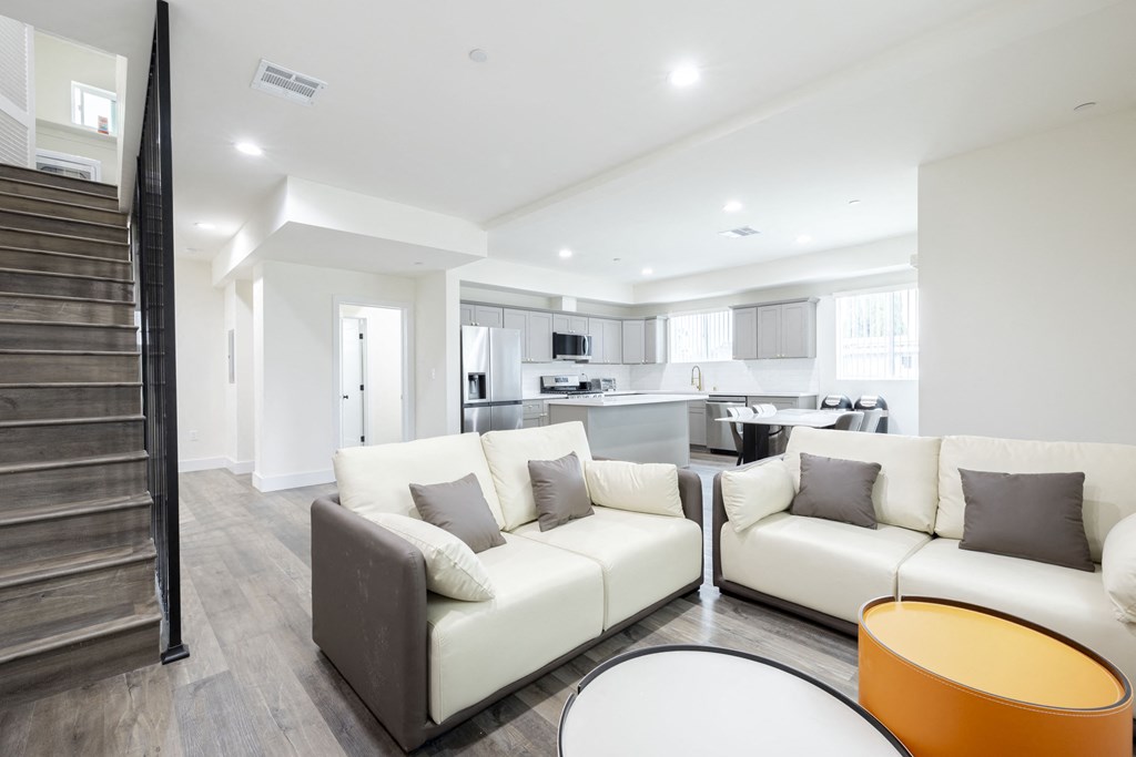 a living room with couches and a table