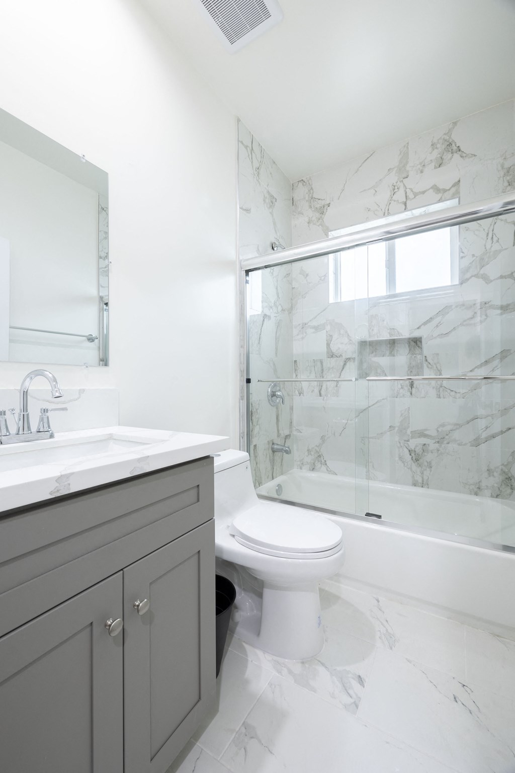 an image of a bathroom with a toilet and a shower