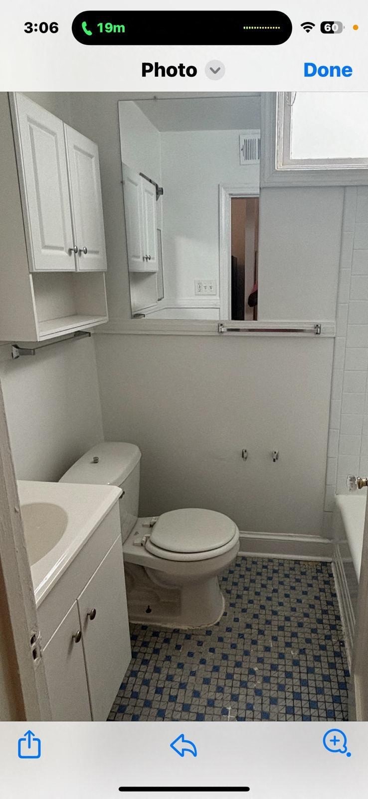a white bathroom with a toilet and a sink