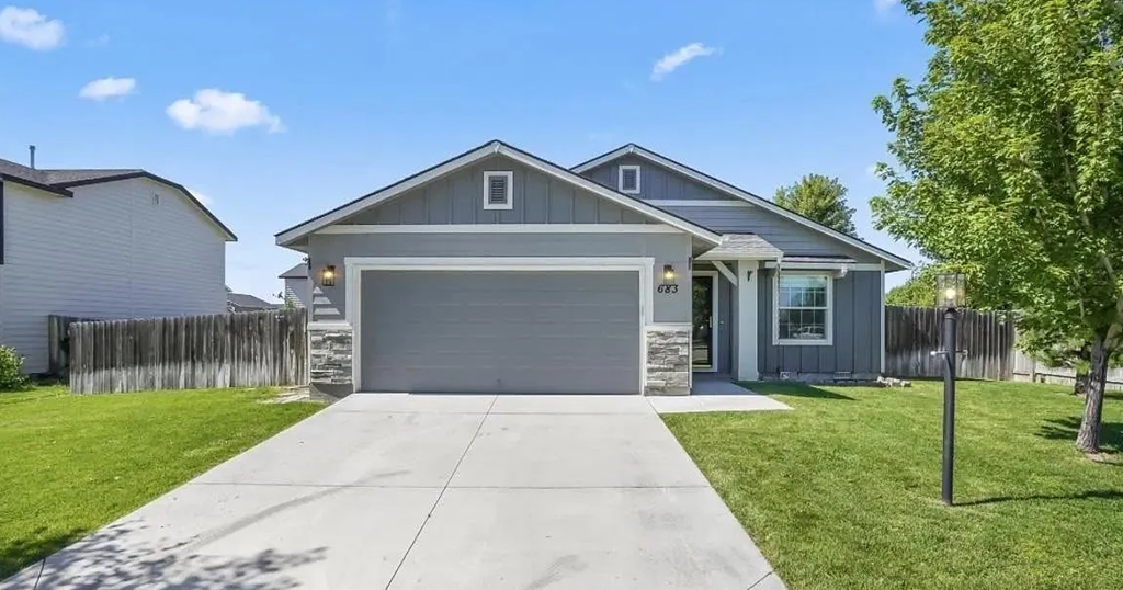 a house with a driveway and a garage door