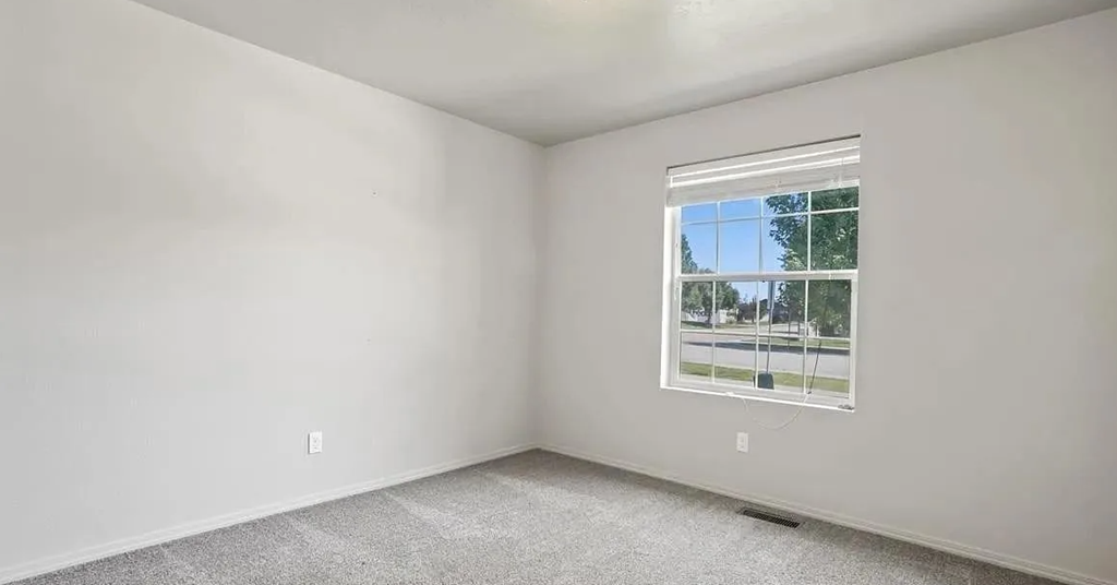 an empty room with a window in it