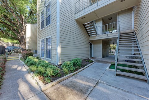 A building with a staircase leading to the second floor.