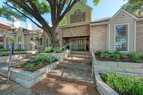 A house with a tree in front of it.