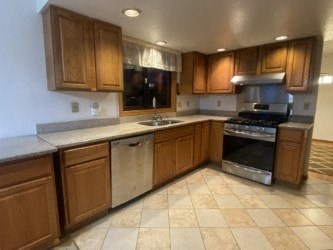 A kitchen with wooden cabinets and a black oven.