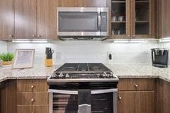 a kitchen with a stove and a microwave