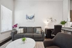 a living room with a couch and a table