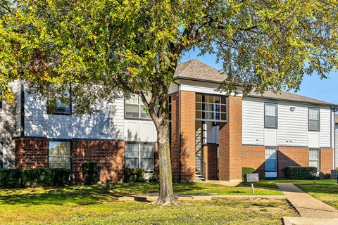 our apartments are located in a neighborhood with a playground and grass