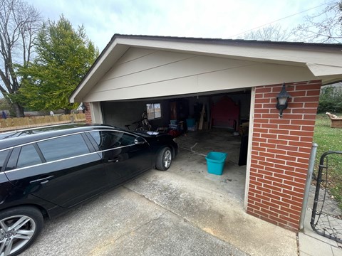 a car parked in the garage of a house