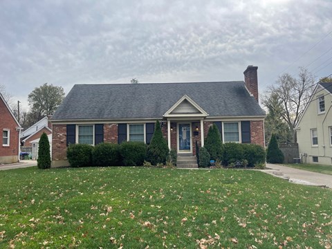a house with a lawn in front of it