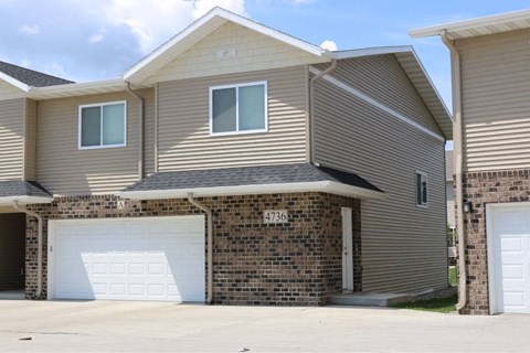 A house with a garage door numbered 4736.