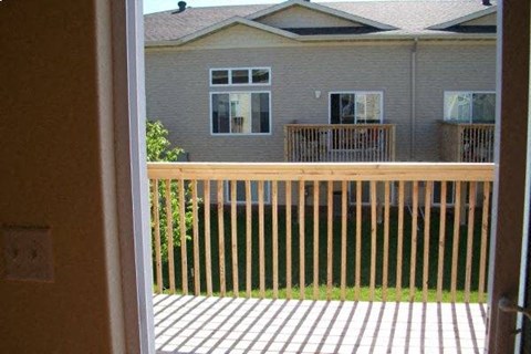 A view of a house through a sliding glass door.