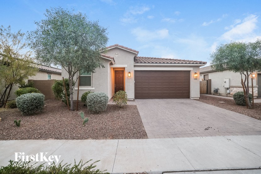 A house with a brown garage door is for sale.
