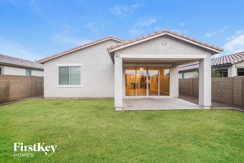 A house with a large front yard is for sale.