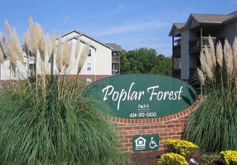 a sign for the popular forest park in front of a building