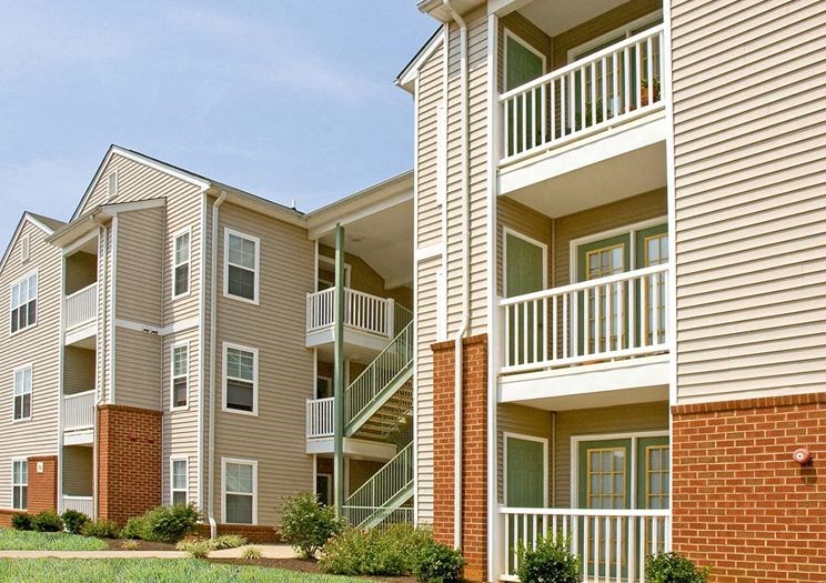 a row of apartment buildings with balconies