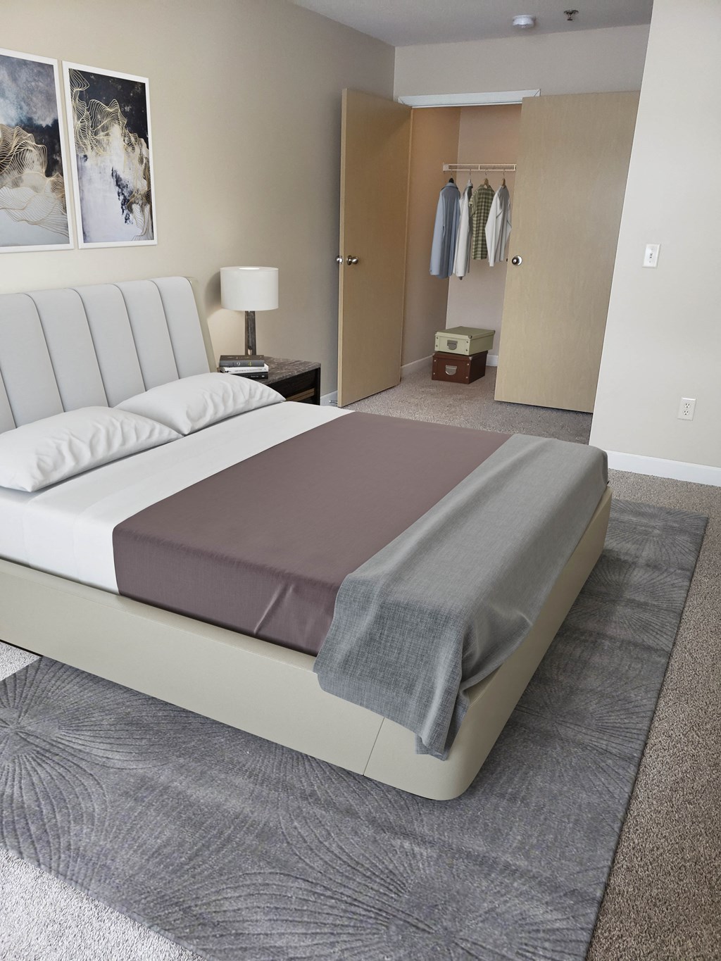 a bedroom with a bed with a grey blanket on it