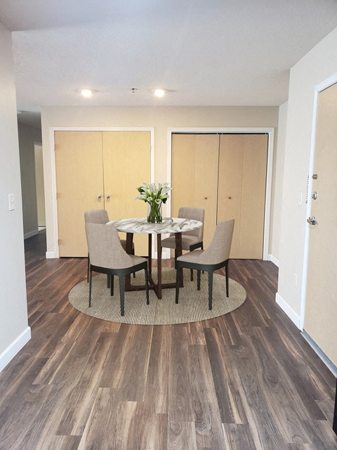 a dining room with a table and chairs
