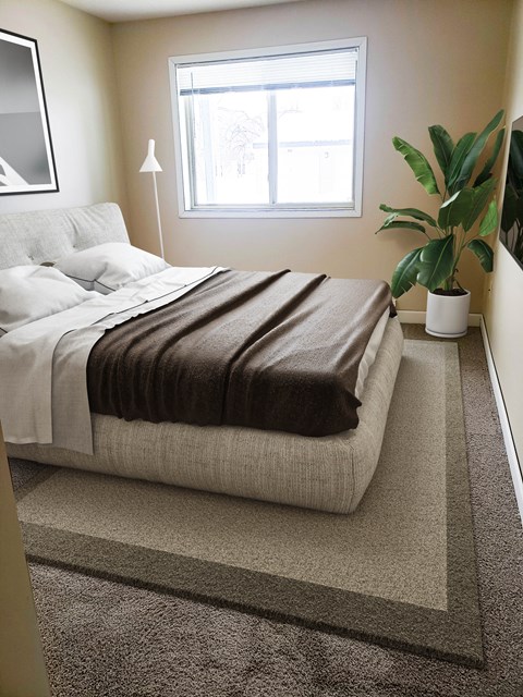 a bedroom with a bed and a potted plant