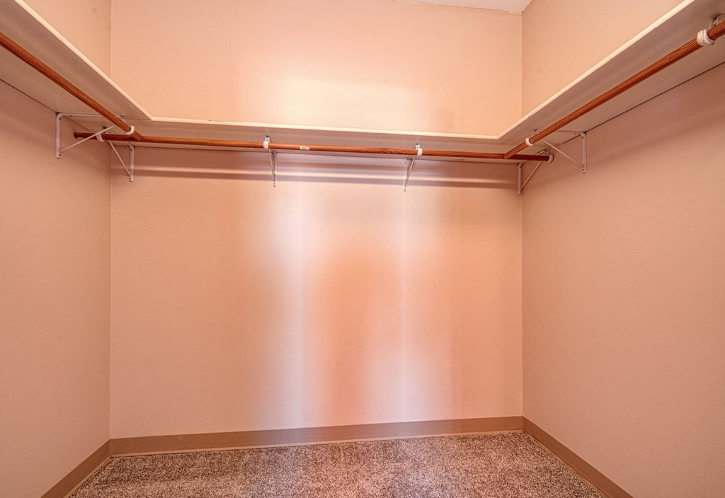a empty storage room with a wall and a pipe in it