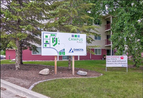 a sign for campus place in front of a building