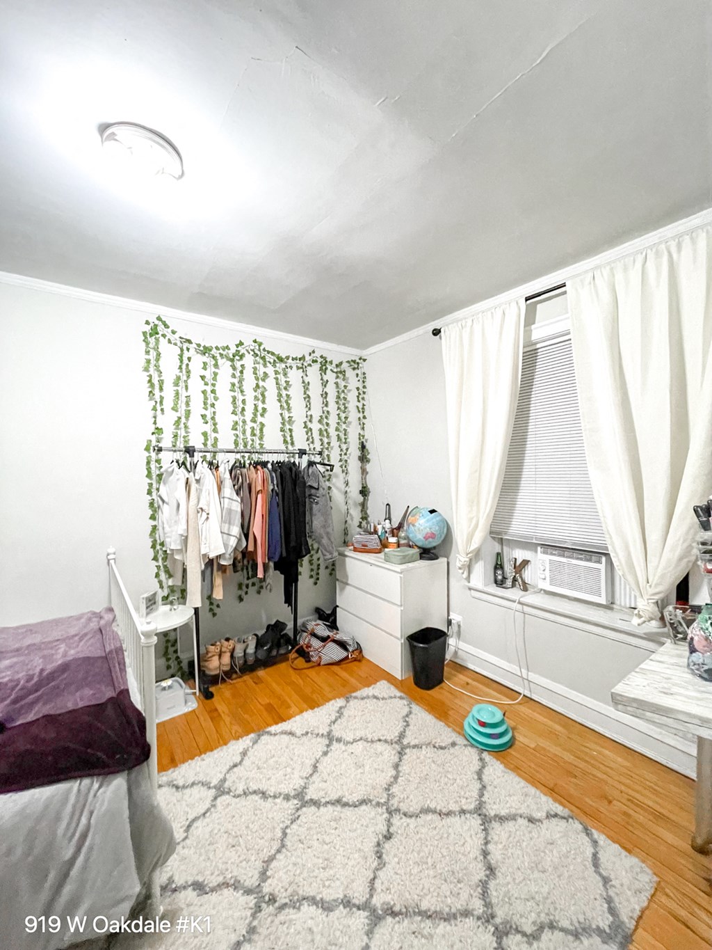 a bedroom with a bed and a closet and a rug