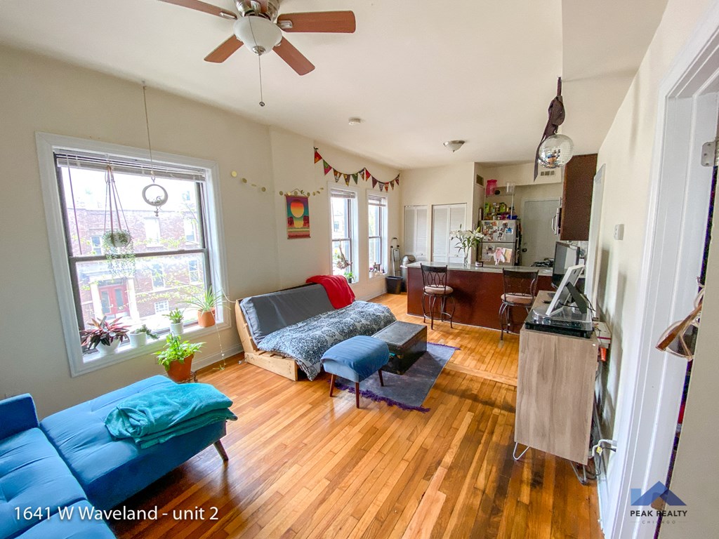 a view of the living room and kitchen from the dining room