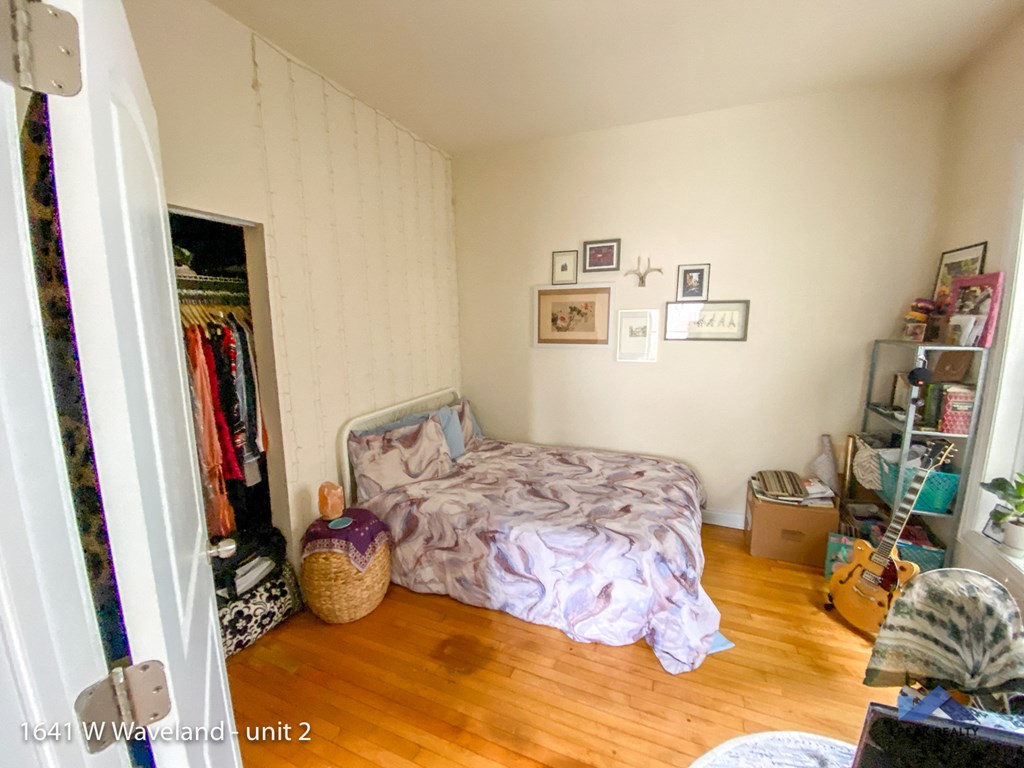 a bedroom with a bed and a closet