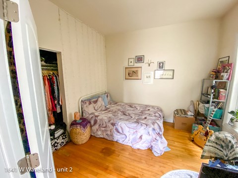 a bedroom with a bed and a closet