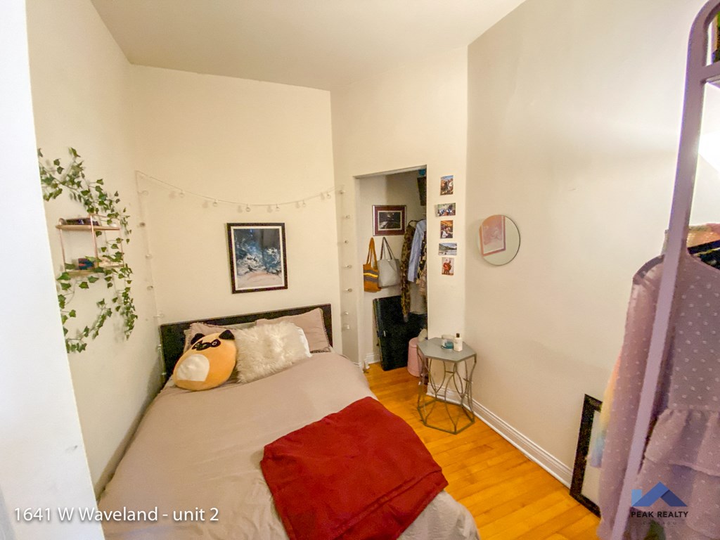 a bedroom with a bed and a closet