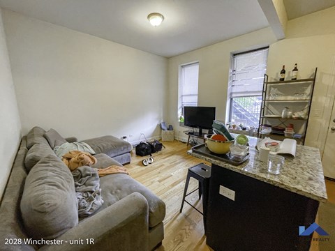 a living room with a couch and a tv