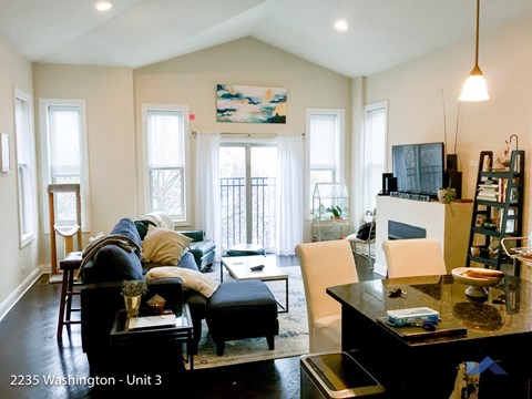 a living room with a couch and a table