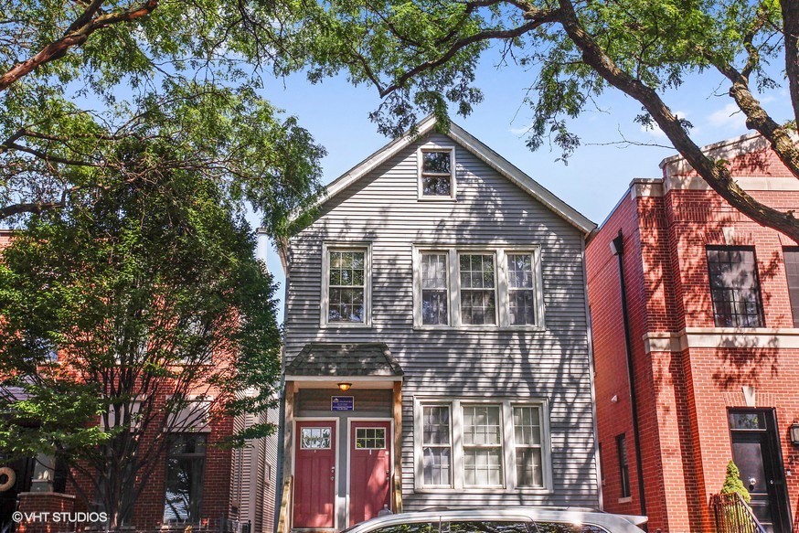 a house with a car parked in front of it