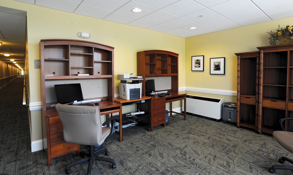 a commercial office with a desk and a computer