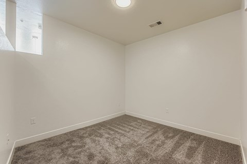 a living room with couches and chairs and a table