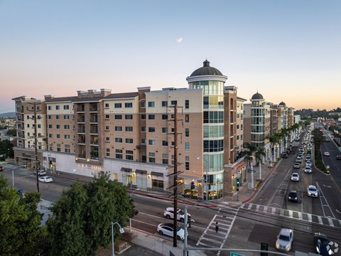 A city street with cars and buildings.