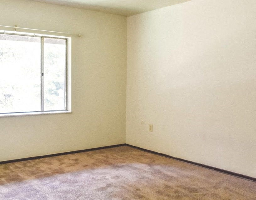 an empty room with a window in it